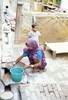 Woman cleaning a pan. Photo: JD.